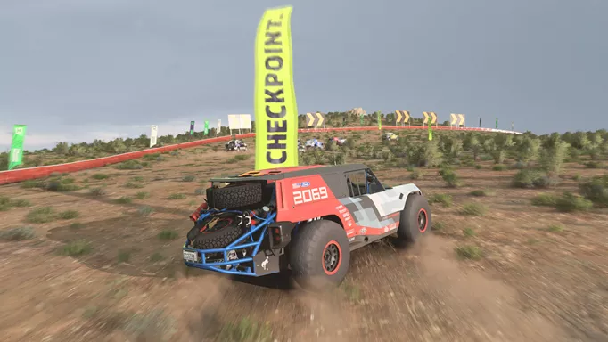 A jeep drifts into a checkpoint flag.