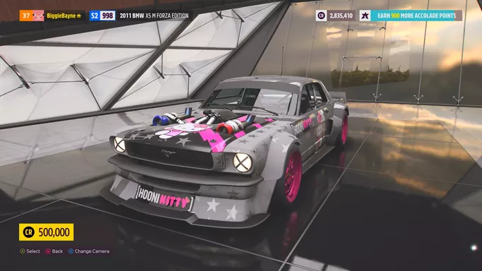 A grey Ford "Hoonicorn" Mustang with pink wheel rims